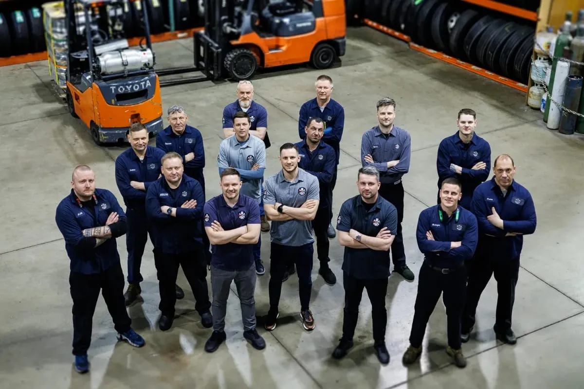 Truck Clinic team members standing together inside the workshop